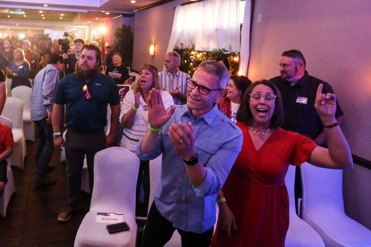Supporters of Pennsylvania GOP governor candidate Doug Mastriano sing songs of worship before seeing him May 17 at his campaign party in Chambersburg.