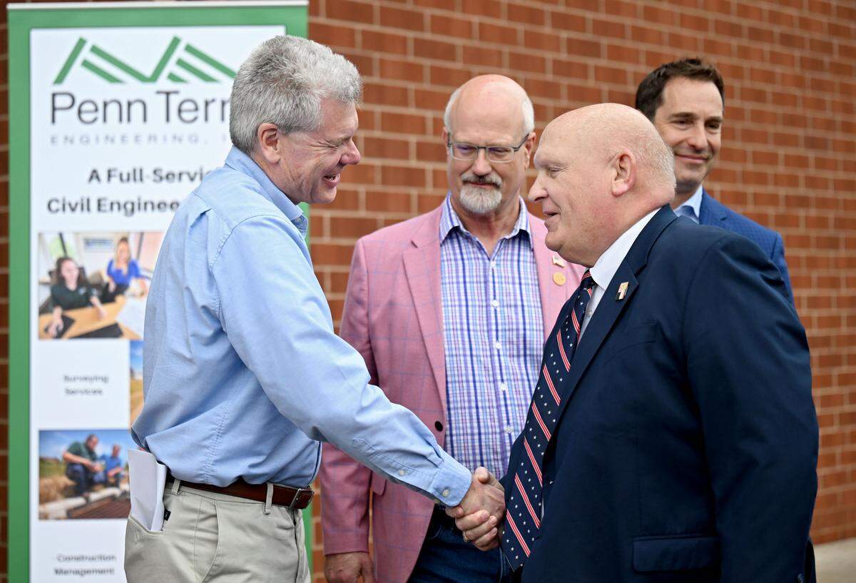 PennTerra Engineering President John Sepp laughs with U.S. Rep Glenn Thompson during a 50th anniversary celebration for PennTerra on Wednesday, April 1, 2026.