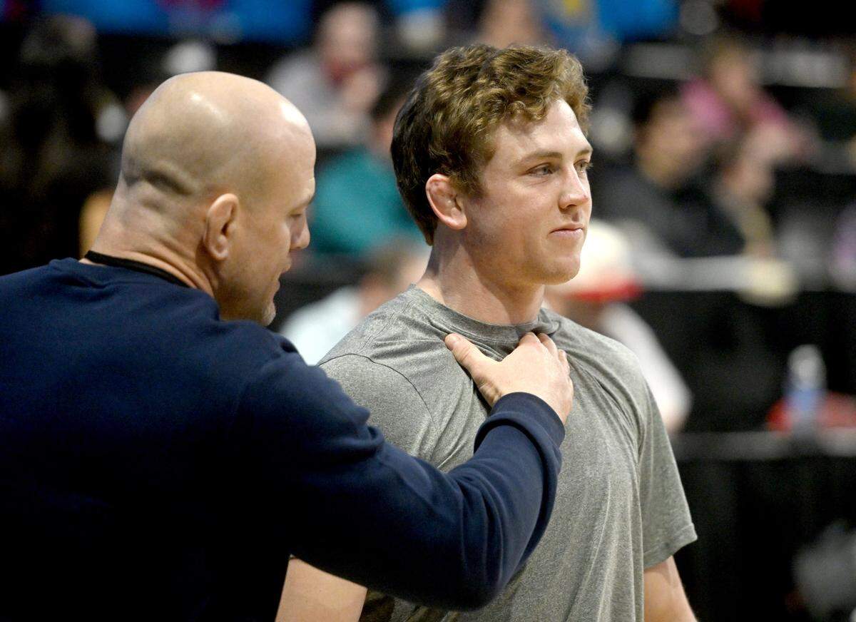 Penn State wrestling coach Cael Sanderson pumps up Bernie Truax before his first match of the Big Ten Wresting Championships at the Xfinity Center at the University of Maryland on Saturday, March 9, 2024.