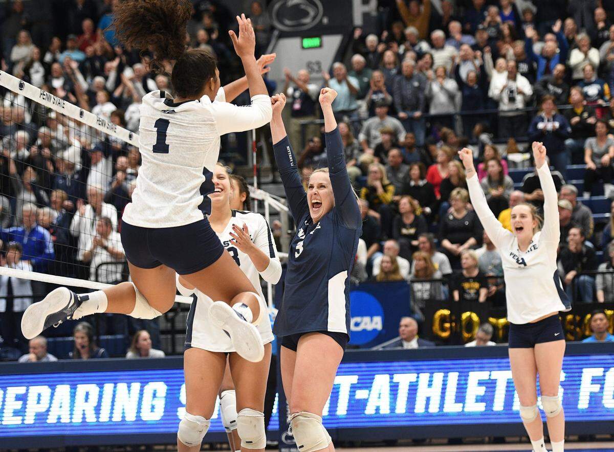 Penn State women’s volleyball celebrates its 3-1 victory over Towson following the NCAA second-round match against Towson in December. (For the CDT/Steve Manuel)