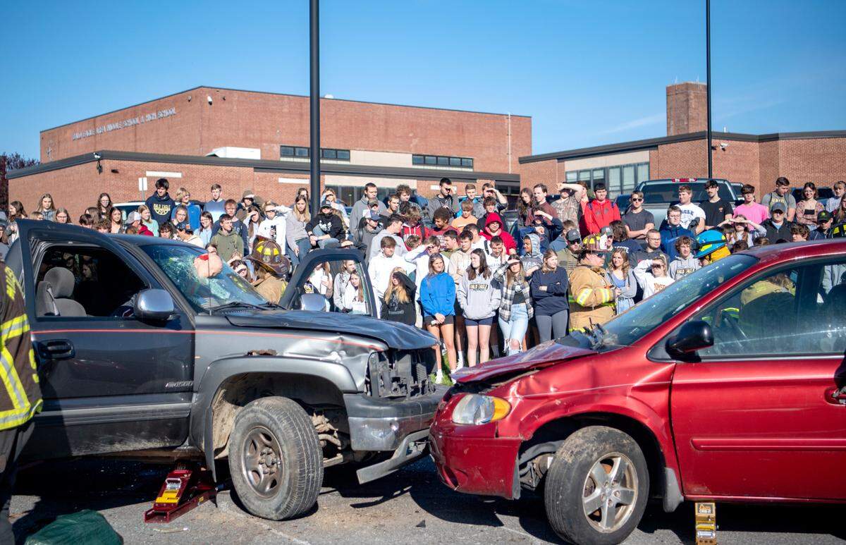Bald Eagle Area High School students watch as emergency crews administer aid to patients of a mock car accident on Tuesday, May 10, 2022.