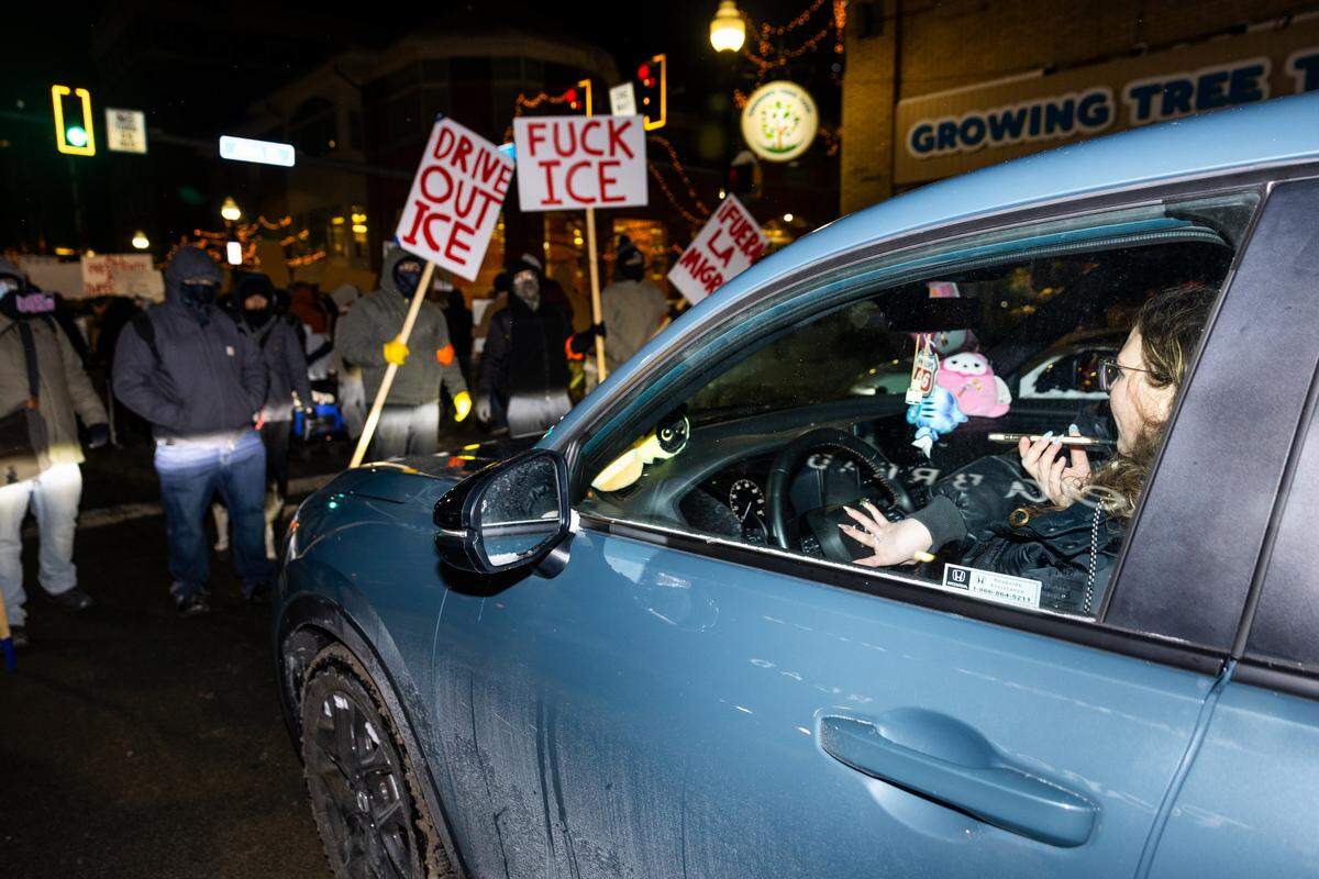 Frustrated drivers honk at anti-ICE protesters for holding up traffic in downtown State College on Monday.