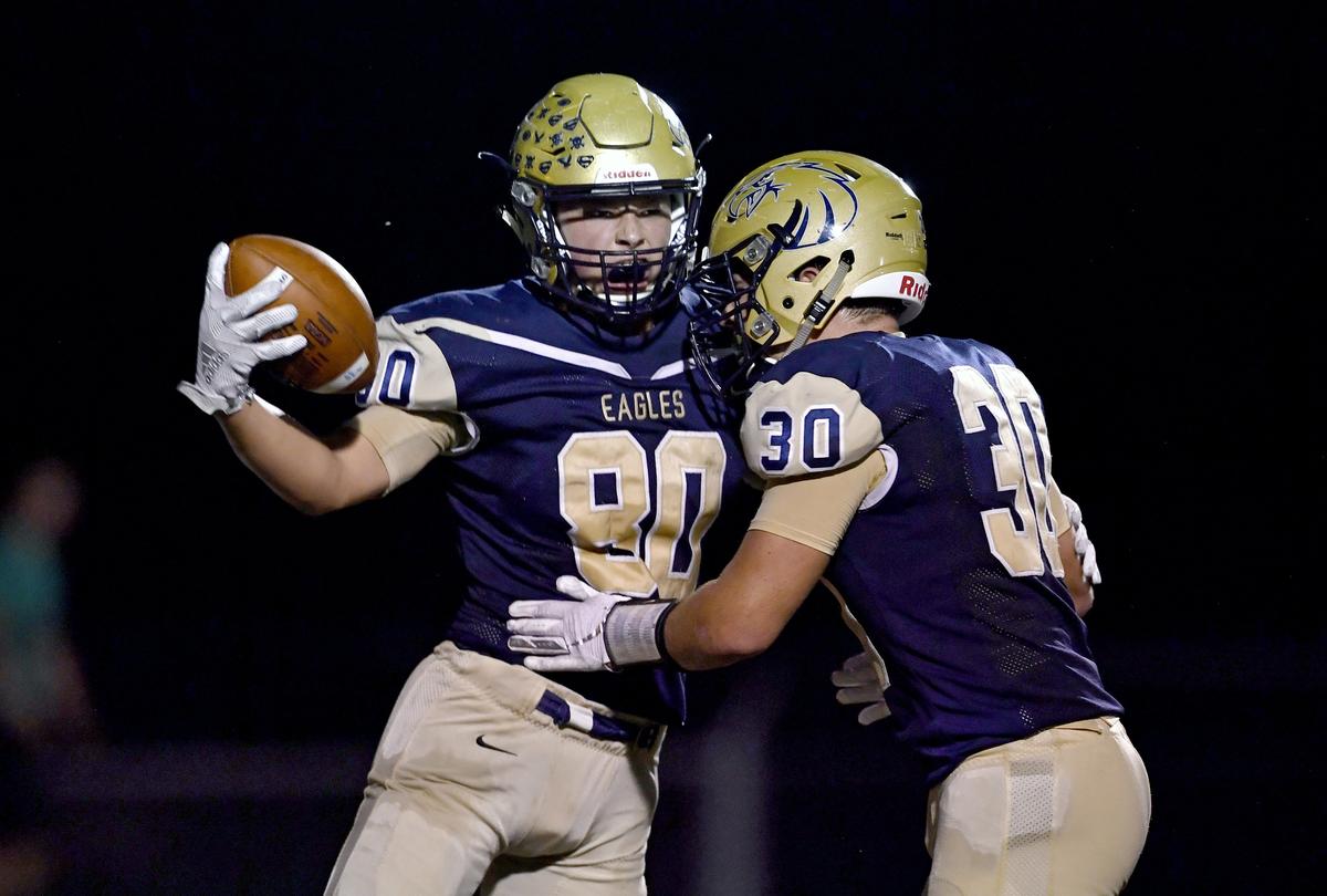 Bald Eagle Area’s Kyler Cunningham is congratulated by teammate Tommy Snyder after his touchdown in the second quarter of the game against Central on Friday, Spet. 20, 2019.