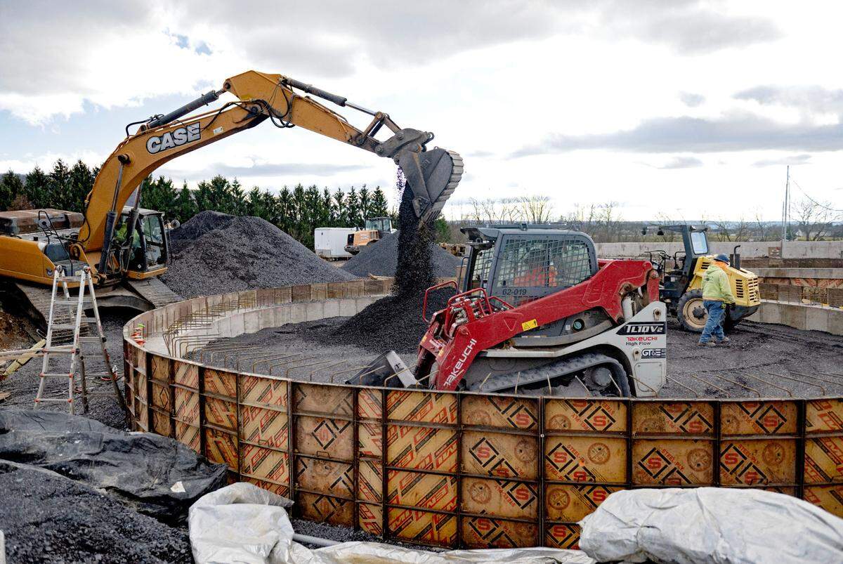 Construction crews work on the anaerobic digesters that are part of the biosolids project at the University Area Joint Authority.