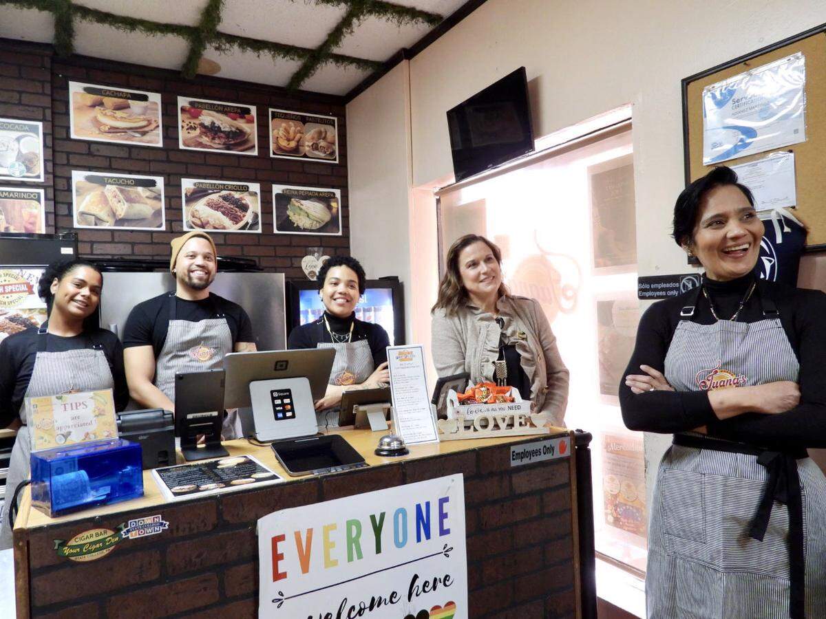 Adianez Martinez (far right), owner of Juana’s in downtown State College, along with her family and Downtown State College Improvement District Executive Director Lee Anne Jeffries (second from the right) welcomed members of the Shapiro administration Thursday.