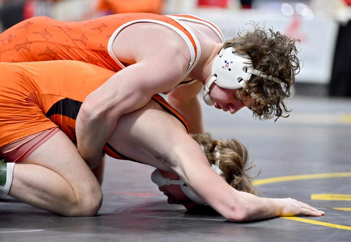 Saint Joseph’s Zack Witmer controls Harbor Creek’s Connor Pierce in the 133 lb third place bout at the PIAA AA wrestling championships on Friday, March 12, 2021 at the Hershey Giant Center. Witmer won by decision, 4-0.