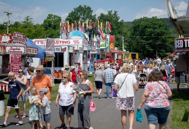 Guests browse the food options at the People’s Choice Festival on Friday, July 14, 2023.
