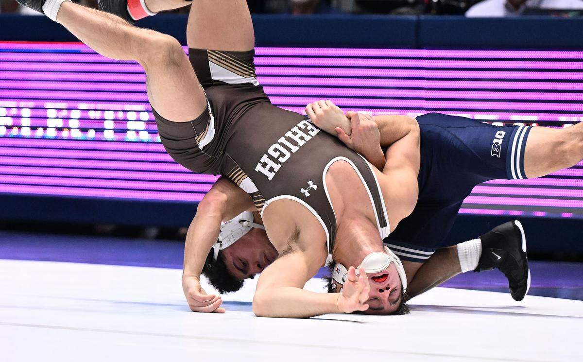 Penn State’s Beau Bartlett (rear) takes down Lehigh’s Carter Bailey (141 lbs) during Sunday’s match at Recreational Hall at Penn State. Bartlett defeated Bailey in a major decision, 14-6. Penn State defeated Lehigh, 30-10.