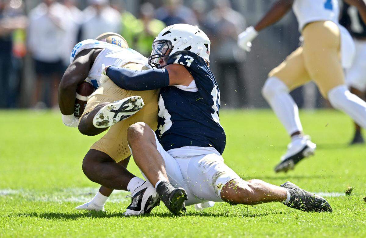 Penn State linebacker Tony Rojas stops UCLA’s T.J. Harden during the game on Saturday, Oct. 5, 2024 at Beaver Stadium.