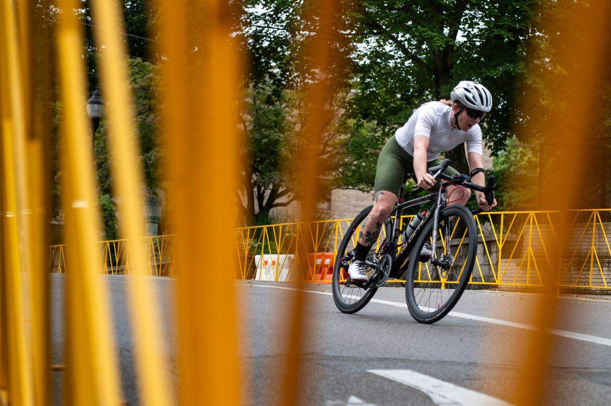 A Women’s Cat 1, Cat 2 and Cat 3 racer cycles down Beaver Avenue during the State College Criterium on Saturday, July 26, 2025 in State College, Pa.
