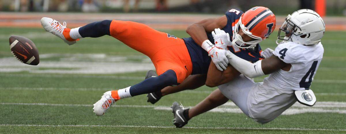 Sep 16, 2023; Champaign, Illinois, USA;  Illinois Fighting Illini wide receiver Ashton Hollins (6) cannot make the catch against Penn State Nittany Lions cornerback Karen King (4) during the second half at Memorial Stadium. Mandatory Credit: Ron Johnson-USA TODAY Sports
