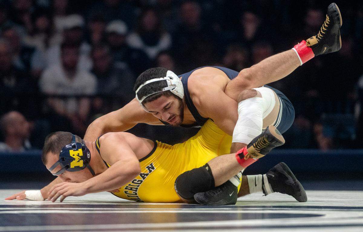 Penn State’s Shayne Van Ness wrestles Michigan’s Fidel Mayora in the 149 lb bout of the match on Friday, Jan. 20, 2023 at the Bryce Jordan Center.