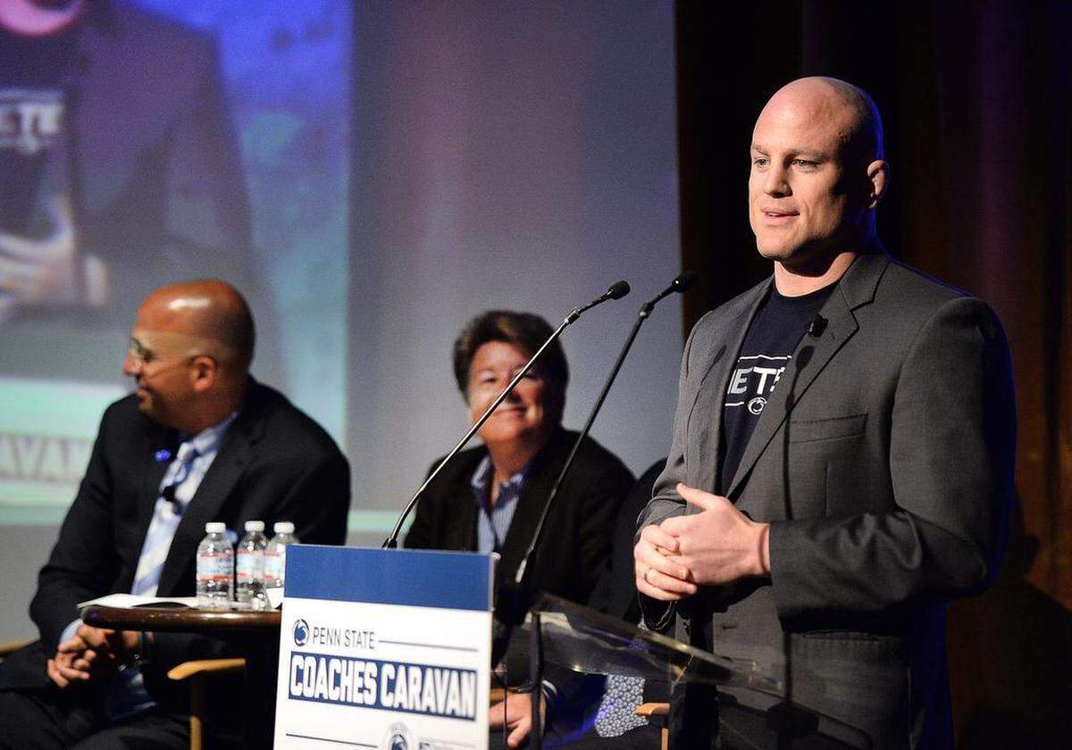 Penn State wrestling coach Cael Sanderson speaks to fans at the Edison Hotel in New York City. He was accompanied by fellow coaches Russ Rose, James Franklin, and Patrick Chambers on the 2015 Coaches Caravan.