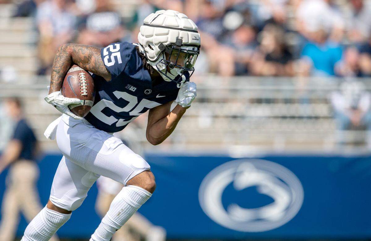 Penn State cornerback Daequan Hardy runs with the ball during the Blue-White game on Saturday, April 23, 2022.
