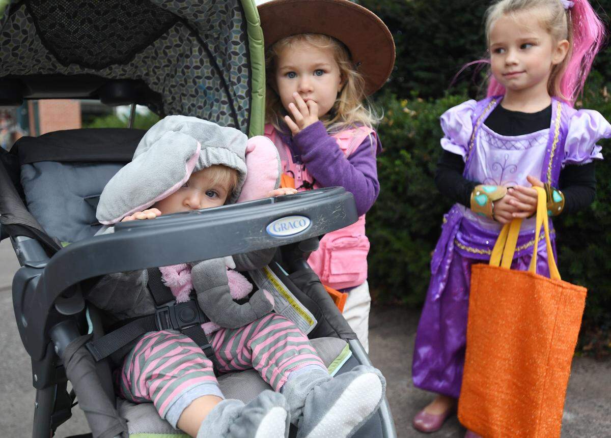 Bexleigh Weber, 11 months, peers out from her stroller while trick or treating at various Bellefonte store fronts in 2017 in Bellefonte.