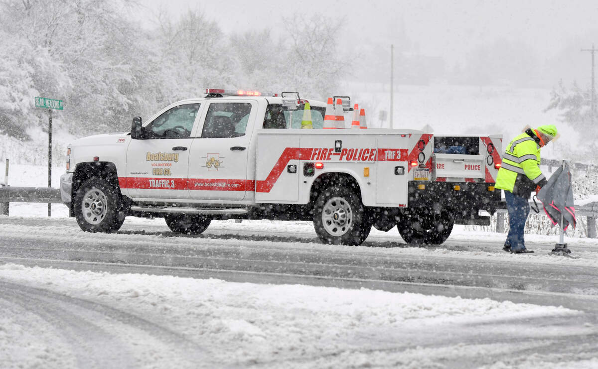 Boalsburg Fire Company fire police work to shut down U.S. Route 322 in Harris Township after a crash on Wednesday, March 9, 2022.