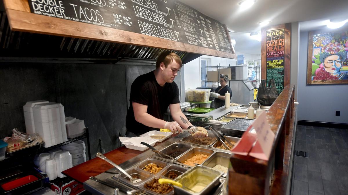 Dylan Gilar makes an order Thursday at Taco Inc. in Pleasant Gap.