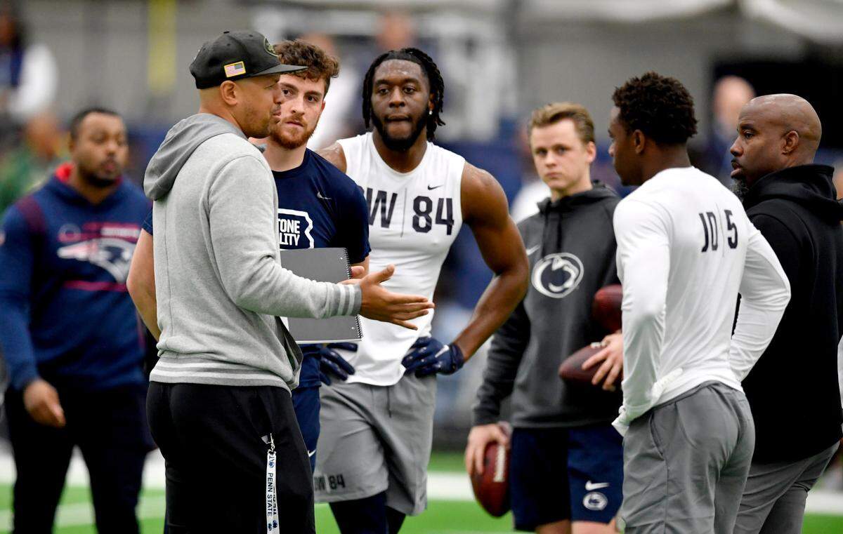 Penn State quarterback Sean Clifford listens to an NFL scout talk to wide receivers during Penn State pro day on Thursday, March 24, 2022. Clifford will play for the Nittany Lions this season but was helping to throw wide receivers for pro day.