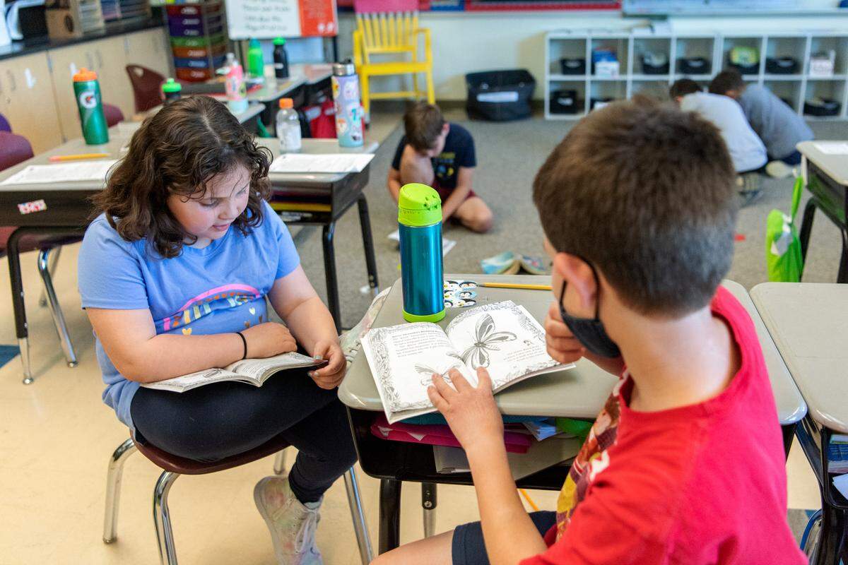 Students in Ali Davenport’s third grade classroom read together at Ferguson Township Elementary School on Wednesday, May 11, 2022.
