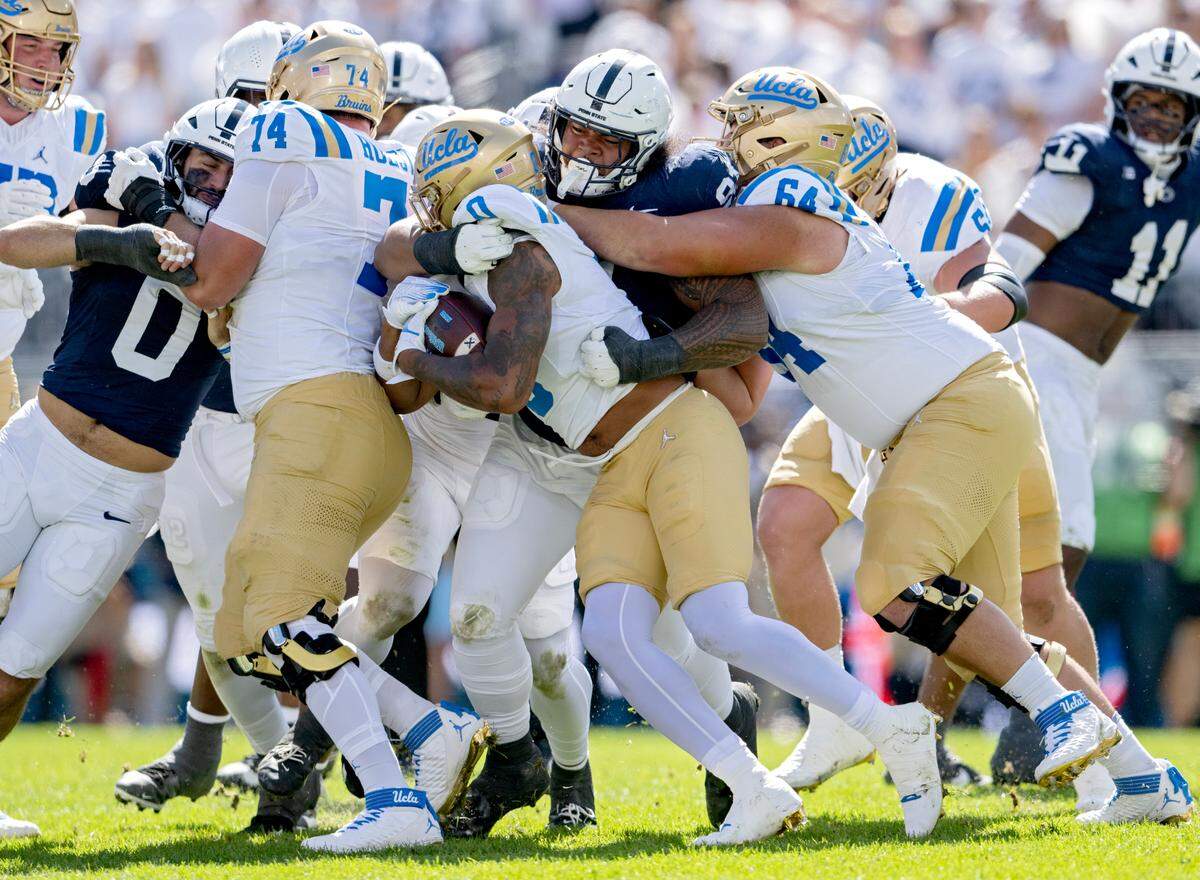 Penn State defensive tackle Dvon J-Thomas stops UCLA’s Jalen Berger during the game on Saturday, Oct. 5, 2024 at Beaver Stadium.