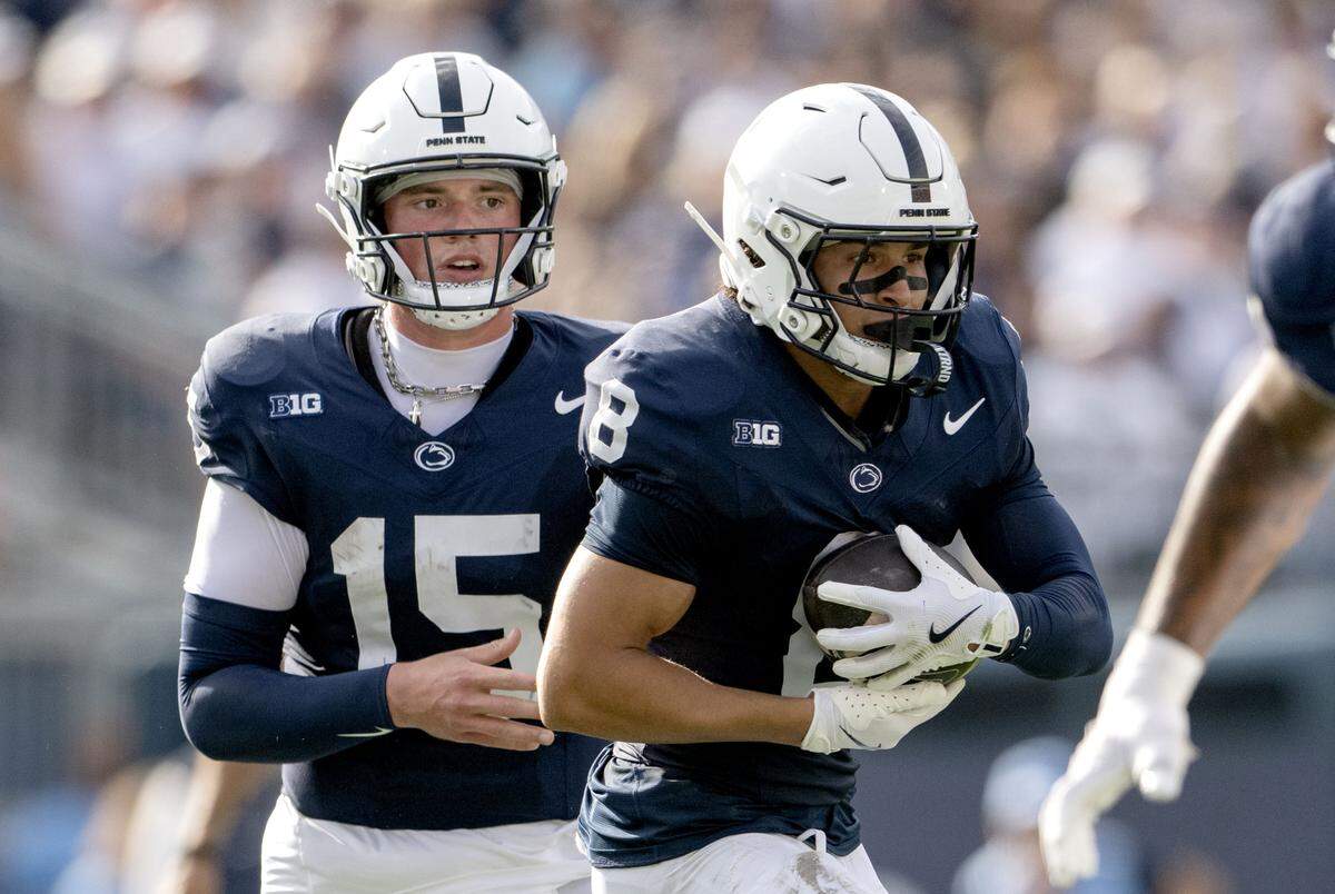 Penn State quarterback Drew Allar hands the ball off to wide receiver Trebor Peña during the game against Villanova on Saturday, Sept. 13, 2025.  