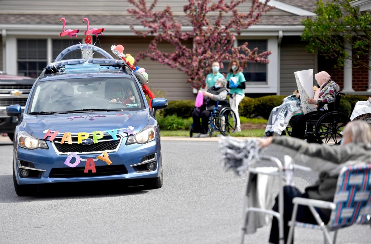 Families decorated their cars for a Mother’s Day parade for the residents of Elmcroft State College on Sunday.