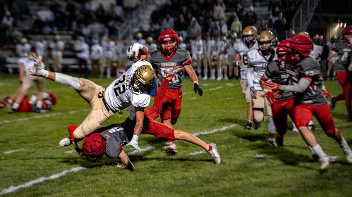 A Bald Eagle Area running back gets tackled while trying to avoid defenders during a Friday night football game against Central in Martinsburg, Pa., on Oct. 17, 2025. The Dragons beat the Eagles 26-25.