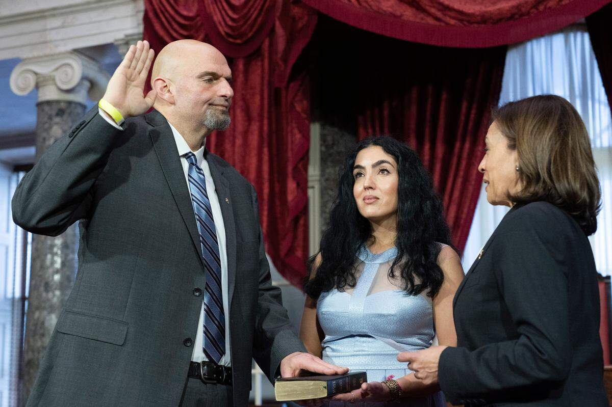 Vice President Kamala Harris, right, participates in a ceremonial swearing-in of Sen. John Fetterman, D-Pa., left, with his wife Gisele Barreto Fetterman, in the Old Senate Chamber on Capitol Hill in Washington, Tuesday, Jan. 3, 2023. (AP Photo/Jacquelyn Martin)