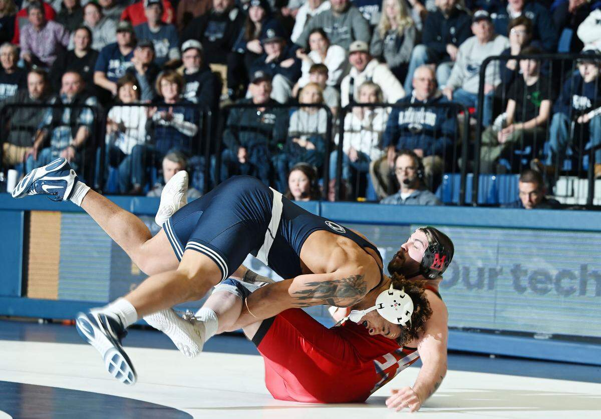 Penn State heavyweight Greg Kerkvliet drives Maryland’s Seth Nevills to the mat enroute to an 8-3 win during Sunday’s meeting in Rec Hall in State College. Penn State defeated Maryland, 35-10.