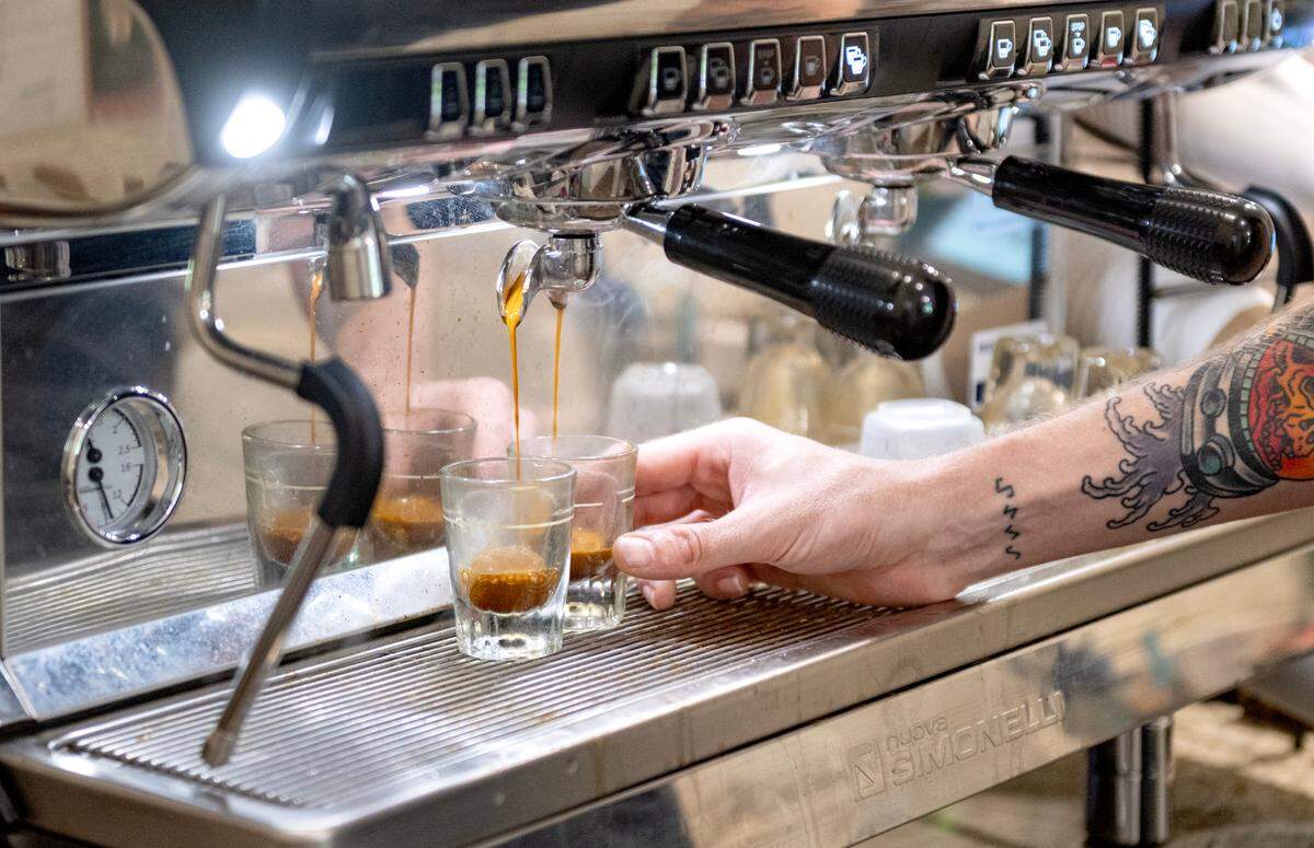 Tyler Wirtz makes espresso for an order at Shaky Hands Coffee Shop on Tuesday, June 10, 2025.