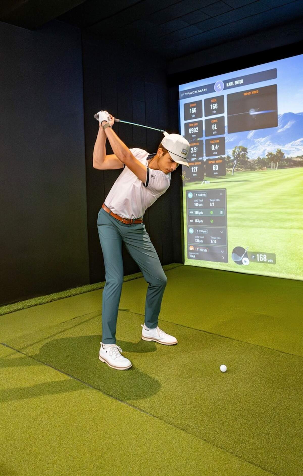 A golfer tries one of the Trackman bays, or golf simulators, at The Golf Resort in Hanover. State College will soon open another location of The Golf Resort, one that will be about four times larger than the one in Hanover. The State College facility will have 10 such Trackman bays.