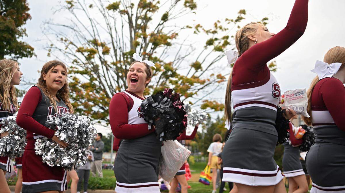 State High cheerleaders pump up the crowd along Westerly Parkway for the homecoming parade on Thursday, Oct. 6, 2022.  