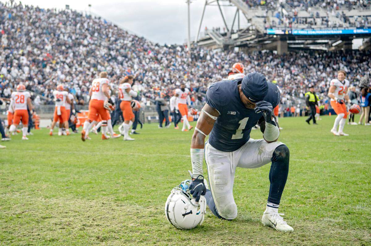 Penn State safety Jaquan Brisker kneels in disappointment after the 9 overtime loss against Illinois on Saturday, Oct. 23, 2021.