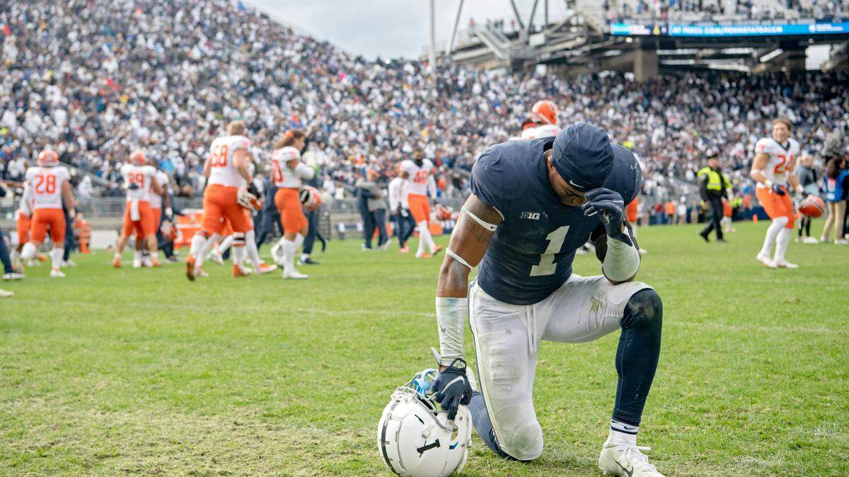Penn State safety Jaquan Brisker kneels in disappointment after the 9 overtime loss against Illinois on Saturday, Oct. 23, 2021.