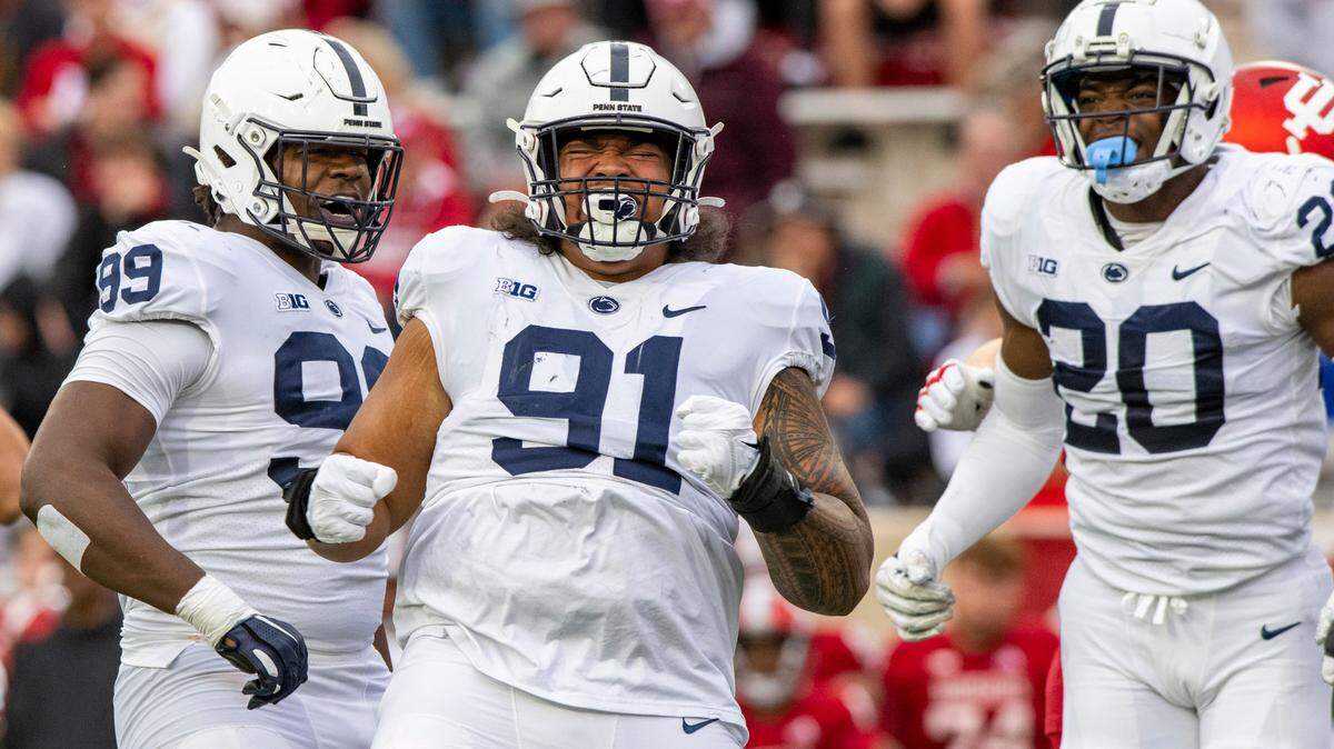 Penn State defensive tackle Dvon Ellies (91) reacts after sacking Indiana quarterback Jack Tuttle during the first half of an NCAA college football game, Saturday, Nov. 5, 2022, in Bloomington, Ind. Tuttle was injured on the play.