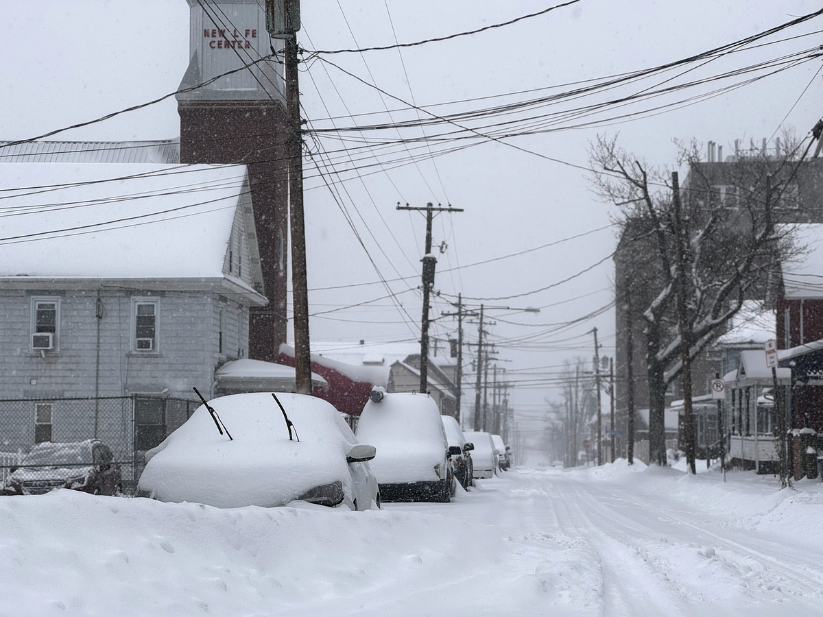 Vehicles parked along South Second Street in Philipsburg collect snow on Sunday.