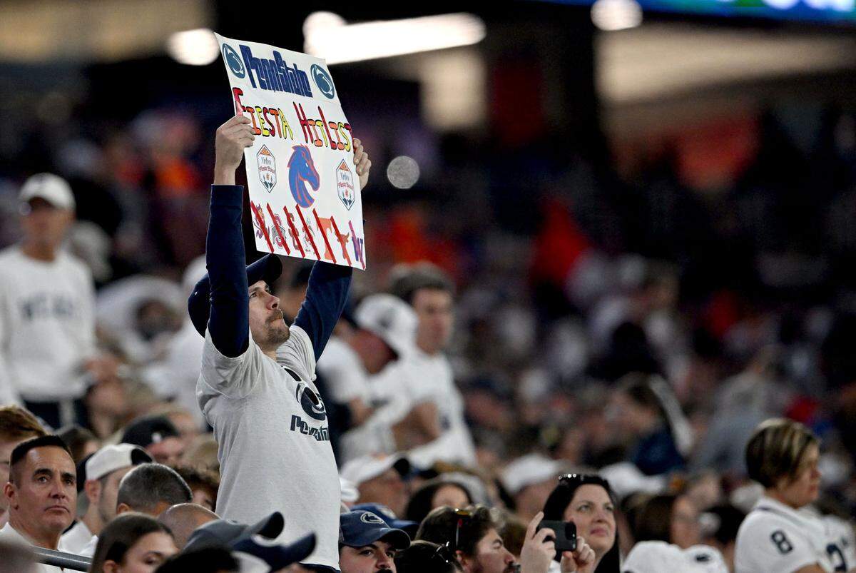 Penn State fans cheer as the team warms up for the Fiesta Bowl against Boise State at State Farm Stadium on Tuesday, Dec. 31, 2024.