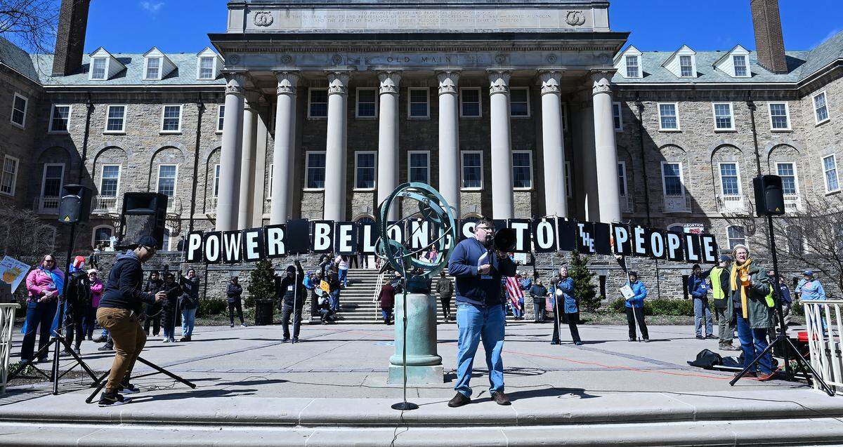 Robert Ziegler speaks to thousands of people gathered on Old Main lawn Saturday for the No Kings anti-Trump rally.