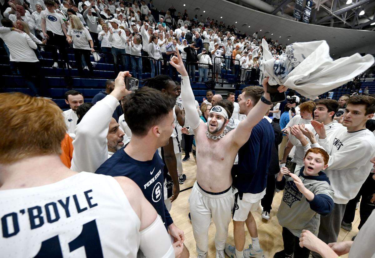 Penn State fans rush the court to celebrate the men’s basketball win over Illinois on Wednesday, Feb. 21, 2024 at Rec Hall.