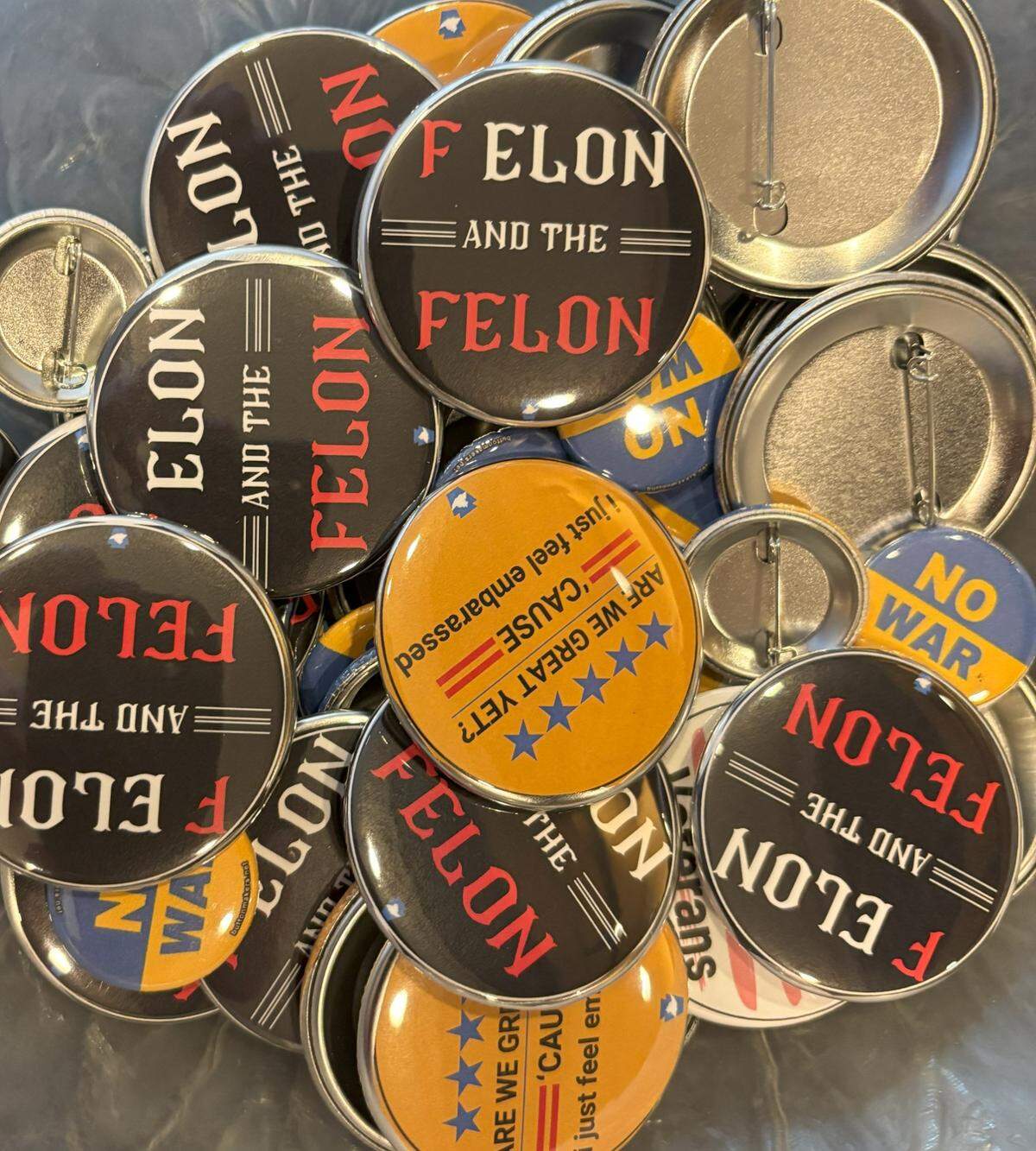 A look at political buttons available in the lobby of The State Theatre during the People’s Town Hall organized Saturday by the Centre County Democrats.