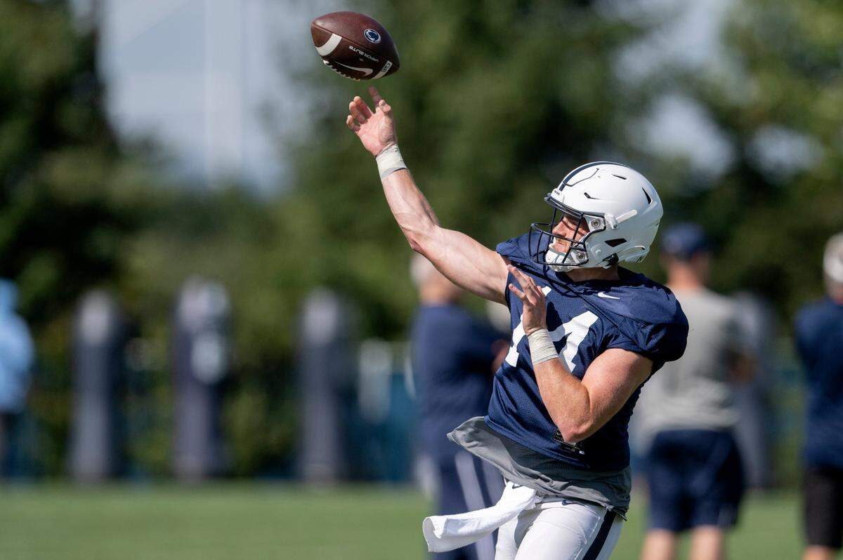 Penn State quarterback Sean Clifford makes a pass during practice on Saturday, Aug. 20, 2022.