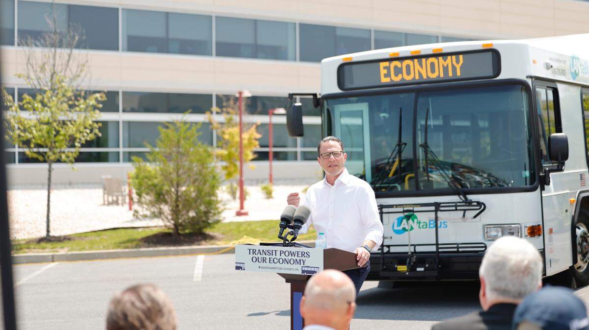 Gov. Josh Shapiro speaks in front of a bus from Lehigh Valley transit agency LANTA.