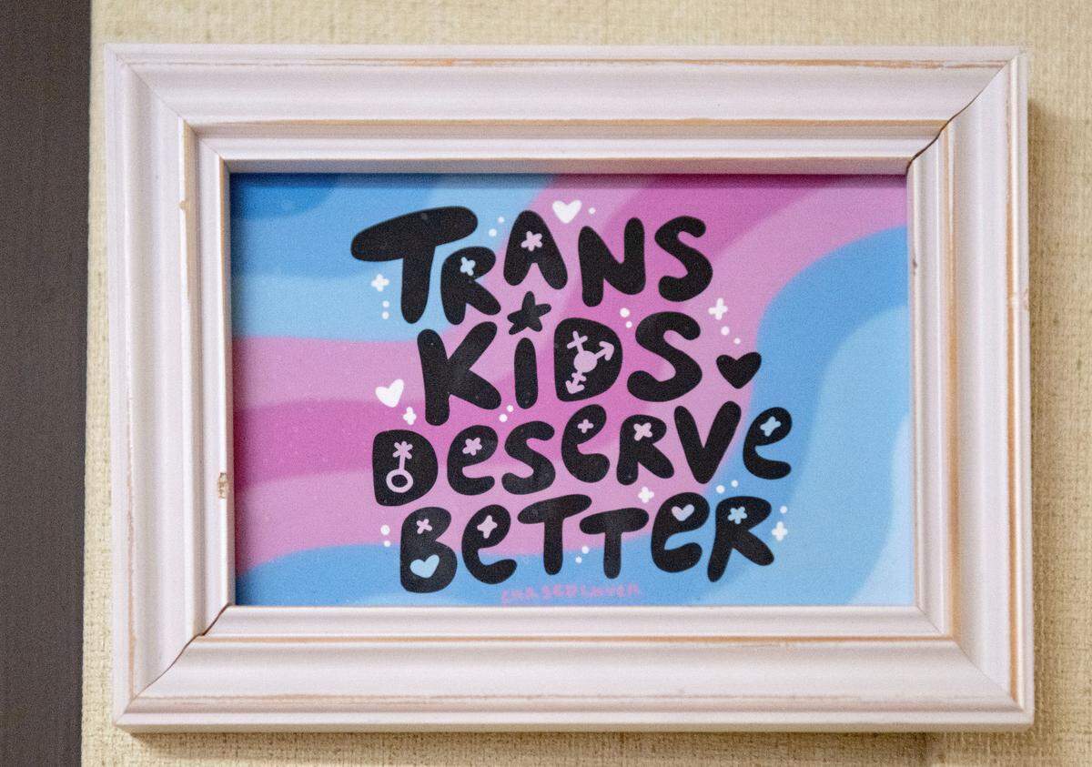 Artwork supporting transgender youth hangs on a wall at the Centre LGBT+ center on Thursday, Feb. 20, 2025.