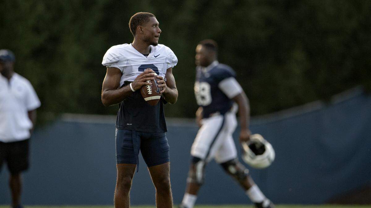 Penn State wide receiver DeAndre Thompkins tosses the ball around with teammates after practice on Wednesday, Aug. 29, 2018.  