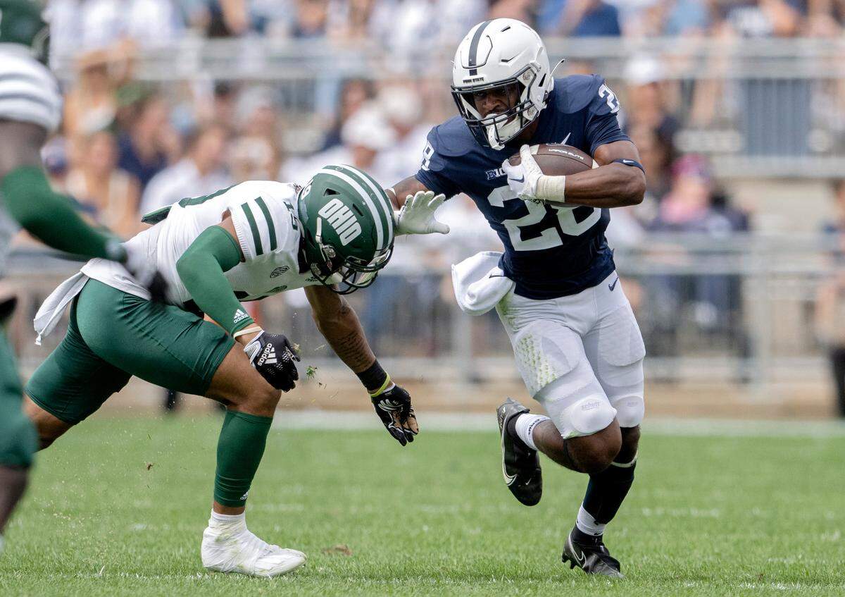 Penn State running back Devyn Ford pushes around an Ohio defender during the game on Saturday, Sept. 10, 2022.