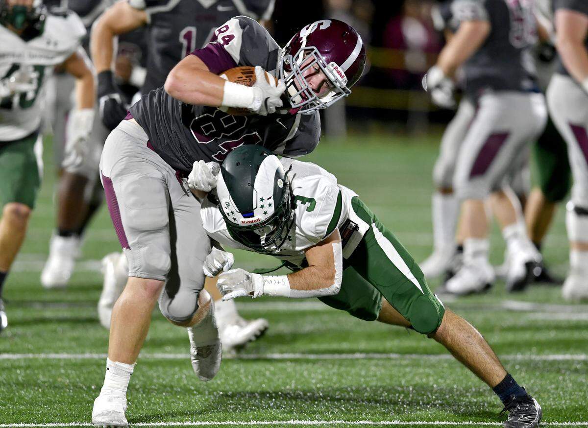 A Central Dauphin defender stops State College’s Nathan Lusk during the game on Friday, Oct. 11, 2019.
