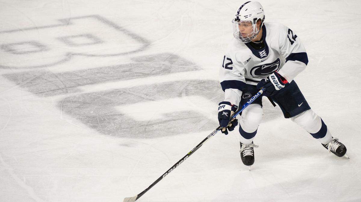Penn State forward Ben Schoen moves up the ice with the puck during the match between Penn State and Ohio State at Pegula Arena on Jan. 29.