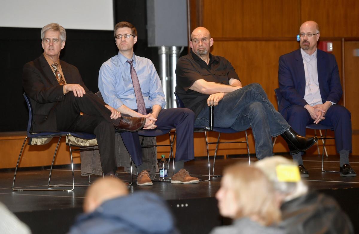 State Representative Scott Conklin, Centre County Commissioner Michael Pipe, Lt. Gov. John Fetterman and Centre County Commissioner Mark Higgins listen to a speaker during a discussion Tuesday on the legalization of recreational marijuana.