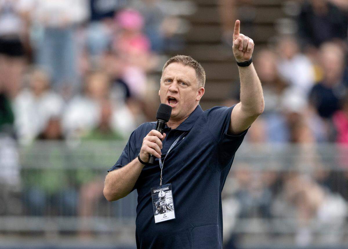 Penn State men’s basketball coach Mike Rhoades leads fans in a “we are” chant during the Penn State Blue-White game on Saturday, April 15, 2023.