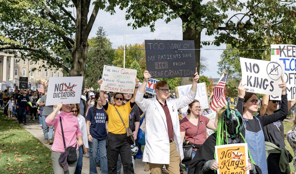 Protesters marched from Old Main throughout downtown State College as part of the No Kings anti-Trump rally on Saturday, Oct. 18, 2025. 
